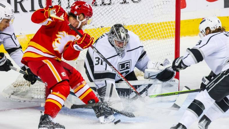 Mar 30, 2024; Calgary, Alberta, CAN; Los Angeles Kings goaltender David Rittich (31) makes a save against the Calgary Flames during the first period at Scotiabank Saddledome. Mandatory Credit: Sergei Belski-USA TODAY Sports