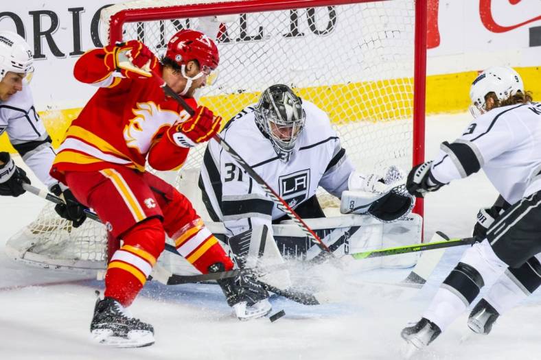 Mar 30, 2024; Calgary, Alberta, CAN; Los Angeles Kings goaltender David Rittich (31) makes a save against the Calgary Flames during the first period at Scotiabank Saddledome. Mandatory Credit: Sergei Belski-USA TODAY Sports