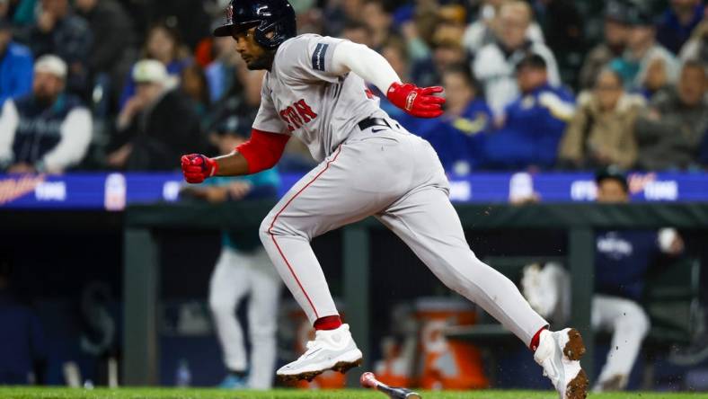 Mar 30, 2024; Seattle, Washington, USA; Boston Red Sox third baseman Pablo Reyes (19) hits an RBI-fielders choice against the Seattle Mariners during the fifth inning at T-Mobile Park. Mandatory Credit: Joe Nicholson-USA TODAY Sports