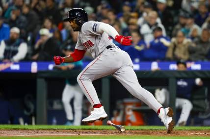 Mar 30, 2024; Seattle, Washington, USA; Boston Red Sox third baseman Pablo Reyes (19) hits an RBI-fielders choice against the Seattle Mariners during the fifth inning at T-Mobile Park. Mandatory Credit: Joe Nicholson-USA TODAY Sports
