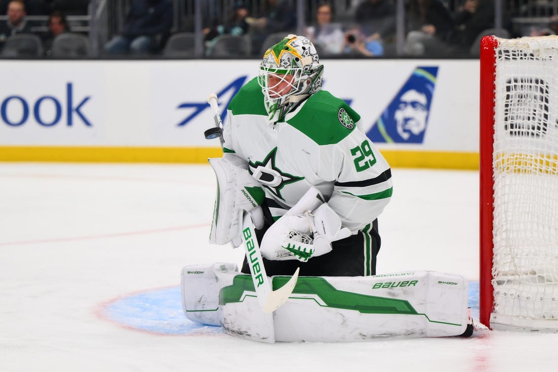 Mar 30, 2024; Seattle, Washington, USA; Dallas Stars goaltender Jake Oettinger (29) blocks a goal shot against the Seattle Kraken during the second period at Climate Pledge Arena. Mandatory Credit: Steven Bisig-USA TODAY Sports