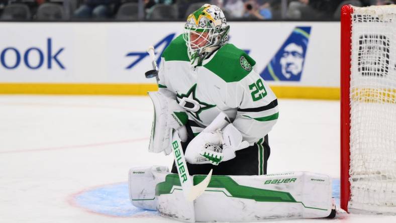 Mar 30, 2024; Seattle, Washington, USA; Dallas Stars goaltender Jake Oettinger (29) blocks a goal shot against the Seattle Kraken during the second period at Climate Pledge Arena. Mandatory Credit: Steven Bisig-USA TODAY Sports