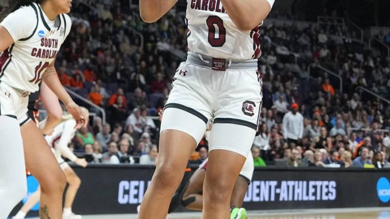 Mar 31, 2024; Albany, NY, USA; South Carolina Gamecocks guard Te-Hina Paopao (0) grabs a rebound against the Oregon State Beavers during the first half in the finals of the Albany Regional of the 2024 NCAA Tournament at MVP Arena. Mandatory Credit: Gregory Fisher-USA TODAY Sports