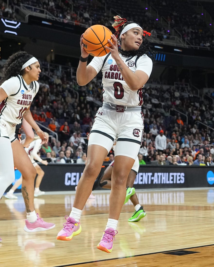 Mar 31, 2024; Albany, NY, USA; South Carolina Gamecocks guard Te-Hina Paopao (0) grabs a rebound against the Oregon State Beavers during the first half in the finals of the Albany Regional of the 2024 NCAA Tournament at MVP Arena. Mandatory Credit: Gregory Fisher-USA TODAY Sports
