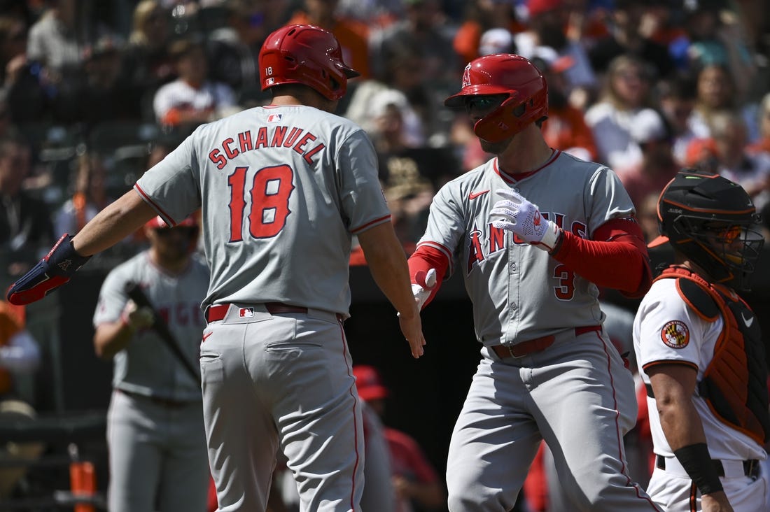 Mar 31, 2024; Baltimore, Maryland, USA;  Los Angeles Angels left fielder Taylor Ward (3) celebrates with  first baseman Nolan Schanuel (18) at home plate after hitting a first inning home run H| at Oriole Park at Camden Yards. Mandatory Credit: Tommy Gilligan-USA TODAY Sports