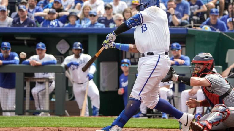 Mar 31, 2024; Kansas City, Missouri, USA; Kansas City Royals first baseman Salvador Perez (13) hits a one RBI single against the Minnesota Twins in the second inning at Kauffman Stadium. Mandatory Credit: Denny Medley-USA TODAY Sports