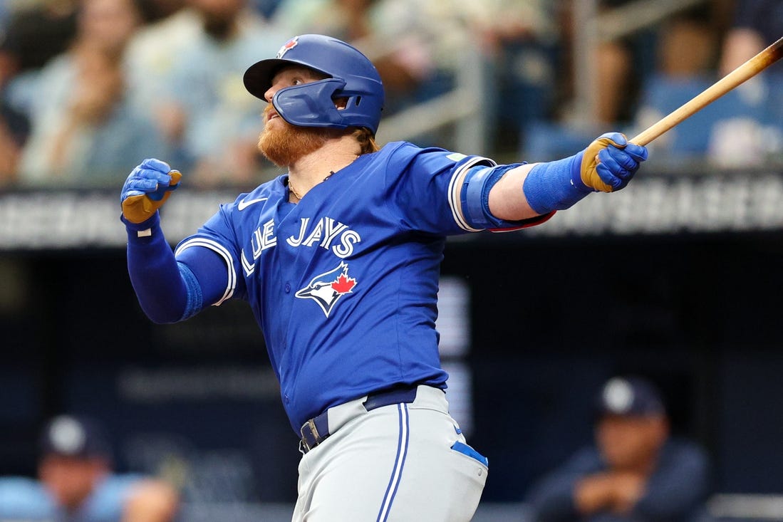 Mar 31, 2024; St. Petersburg, Florida, USA;  Toronto Blue Jays third baseman Justin Turner (2) hits a solo home run against the Tampa Bay Rays in the fifth inning at Tropicana Field. Mandatory Credit: Nathan Ray Seebeck-USA TODAY Sports