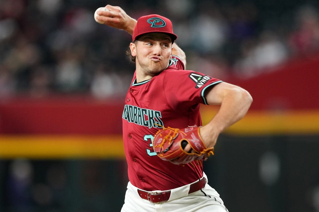 Mar 31, 2024; Phoenix, Arizona, USA; Arizona Diamondbacks starting pitcher Brandon Pfaadt (32) pitches against the Colorado Rockies during the fourth inning at Chase Field. Mandatory Credit: Joe Camporeale-USA TODAY Sports