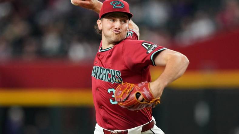 Mar 31, 2024; Phoenix, Arizona, USA; Arizona Diamondbacks starting pitcher Brandon Pfaadt (32) pitches against the Colorado Rockies during the fourth inning at Chase Field. Mandatory Credit: Joe Camporeale-USA TODAY Sports