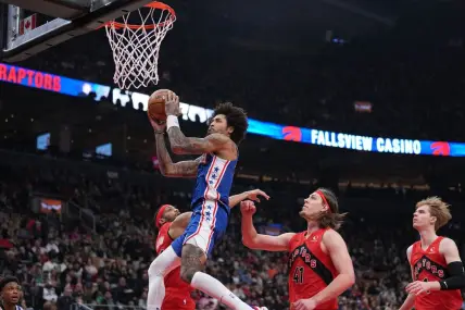 Mar 31, 2024; Toronto, Ontario, CAN; Philadelphia 76ers guard Kelly Oubre Jr. (9) drives to the basket over Toronto Raptors forward Kelly Olynyk (41) during the first quarter at Scotiabank Arena. Mandatory Credit: Nick Turchiaro-USA TODAY Sports