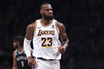 Mar 31, 2024; Brooklyn, New York, USA; Los Angeles Lakers forward LeBron James (23) reacts after a basket against the Brooklyn Nets during the first half at Barclays Center. Mandatory Credit: Vincent Carchietta-USA TODAY Sports