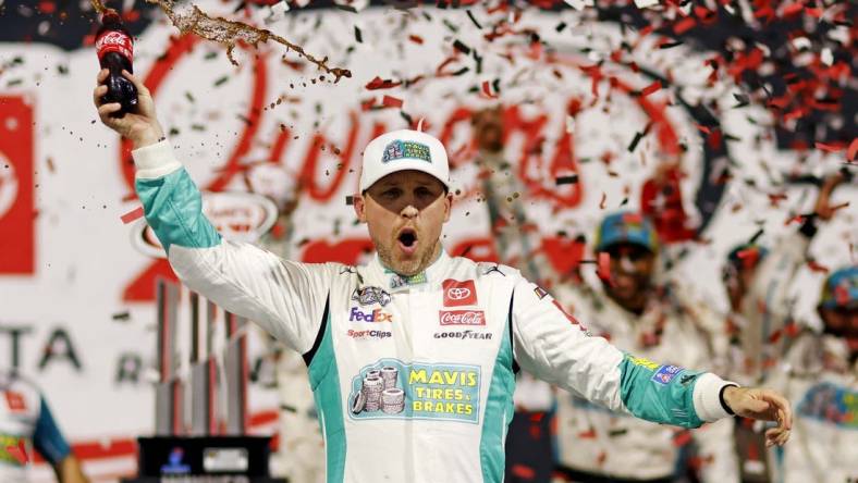 Mar 31, 2024; Richmond, Virginia, USA; NASCAR Cup Series driver Denny Hamlin (11) celebrates winning the Toyota Owners 400 at Richmond Raceway. Mandatory Credit: Peter Casey-USA TODAY Sports