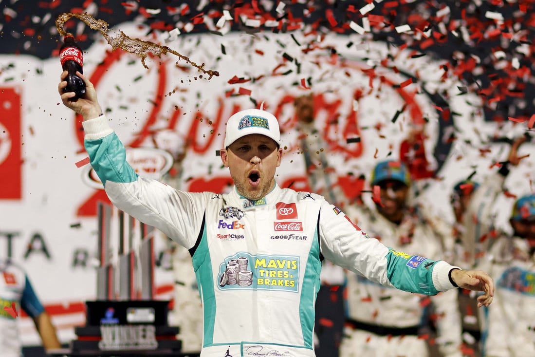 Mar 31, 2024; Richmond, Virginia, USA; NASCAR Cup Series driver Denny Hamlin (11) celebrates winning the Toyota Owners 400 at Richmond Raceway. Mandatory Credit: Peter Casey-USA TODAY Sports