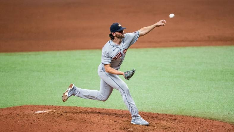 Apr 30, 2021; St. Petersburg, Florida, USA; Houston Astros relief pitcher Kent Emanuel (0) delivers a pitch during the eighth inning of a game against the Tampa Bay Rays at Tropicana Field. Mandatory Credit: Mary Holt-USA TODAY Sports