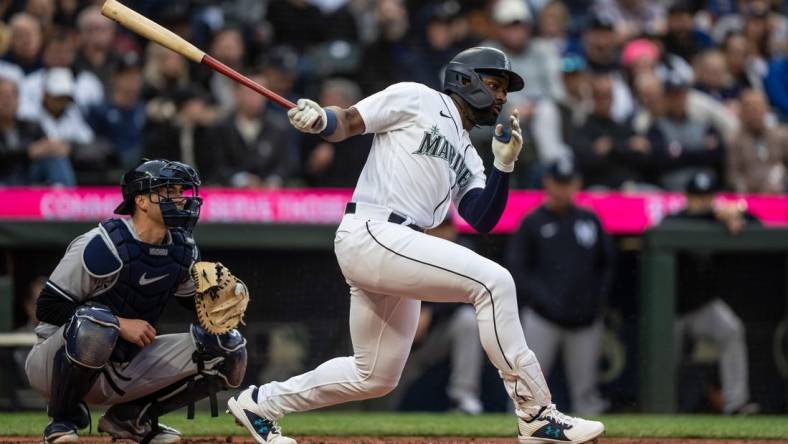 May 31, 2023; Seattle, Washington, USA; Seattle Mariners designated hitter Taylor Trammell (5) takes a swing during an at-bat against the New York Yankees at T-Mobile Park. Mandatory Credit: Stephen Brashear-USA TODAY Sports