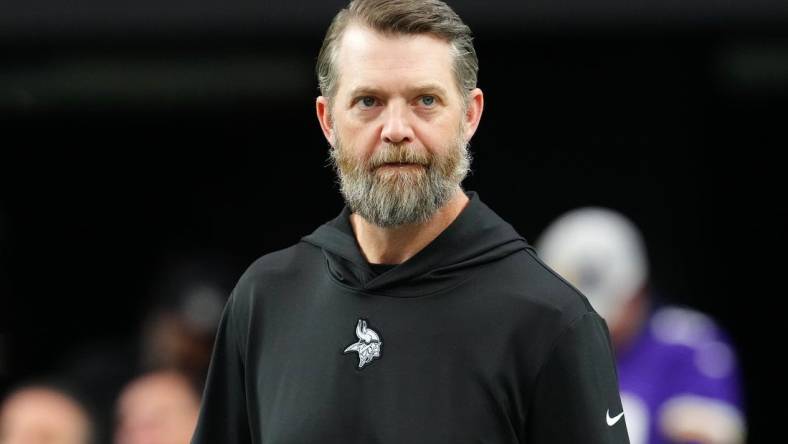 Dec 10, 2023; Paradise, Nevada, USA; Minnesota Vikings Offensive Coordinator Wes Phillips walks on the field before a game between the Vikings and the Las Vegas Raiders at Allegiant Stadium. Mandatory Credit: Stephen R. Sylvanie-USA TODAY Sports