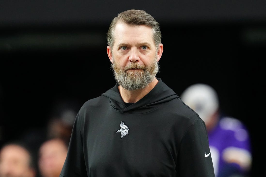 Dec 10, 2023; Paradise, Nevada, USA; Minnesota Vikings Offensive Coordinator Wes Phillips walks on the field before a game between the Vikings and the Las Vegas Raiders at Allegiant Stadium. Mandatory Credit: Stephen R. Sylvanie-USA TODAY Sports