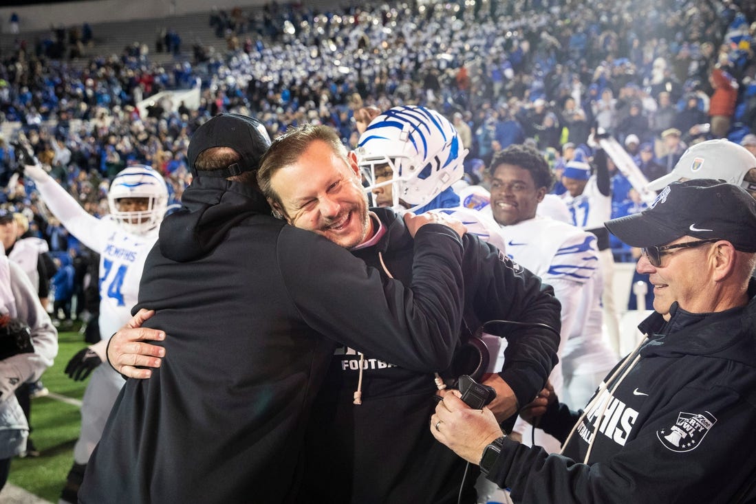 Memphis' head coach Ryan Silverfield celebrates with his team after they defeated Iowa State 36-26 in the AutoZone Liberty Bowl at Simmons Bank Liberty Stadium on Dec. 29, 2023.