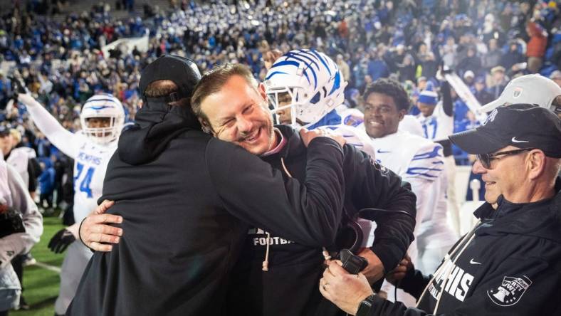 Memphis' head coach Ryan Silverfield celebrates with his team after they defeated Iowa State 36-26 in the AutoZone Liberty Bowl at Simmons Bank Liberty Stadium on Dec. 29, 2023.