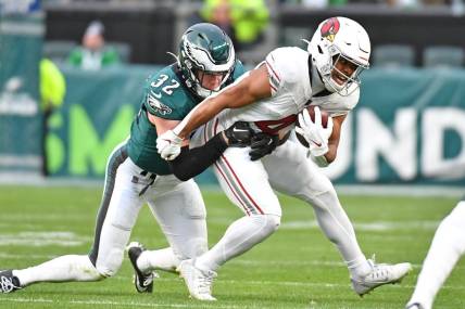 Dec 31, 2023; Philadelphia, Pennsylvania, USA; Arizona Cardinals wide receiver Rondale Moore (4) is tackled by Philadelphia Eagles safety Reed Blankenship (32) during the fourth quarter at Lincoln Financial Field. Mandatory Credit: Eric Hartline-USA TODAY Sports