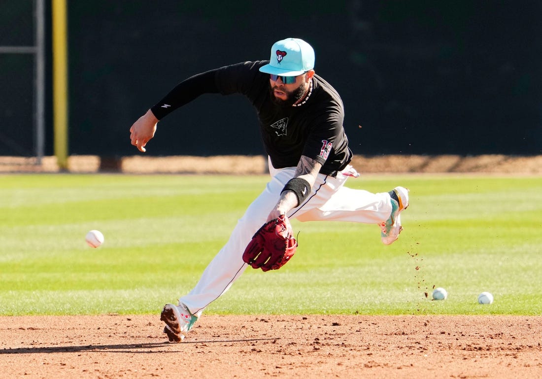 Arizona Diamondbacks' Emmanuel Rivera fields a ground ball during spring training workouts at Salt River Fields at Talking Stick in Scottsdale on Feb. 22, 2024.