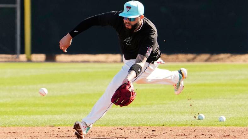 Arizona Diamondbacks' Emmanuel Rivera fields a ground ball during spring training workouts at Salt River Fields at Talking Stick in Scottsdale on Feb. 22, 2024.