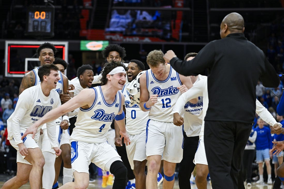 Mar 10, 2024; St. Louis, MO, USA;  Drake Bulldogs celebrate after defeating the Indiana State Sycamores to win the Missouri Valley Conference Tournament Championship at Enterprise Center. Mandatory Credit: Jeff Curry-USA TODAY Sports