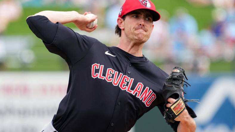 Mar 12, 2024; Surprise, Arizona, USA; Cleveland Guardians starting pitcher Shane Bieber (57) bats against the Texas Rangers during the second inning at Surprise Stadium. Mandatory Credit: Joe Camporeale-USA TODAY Sports