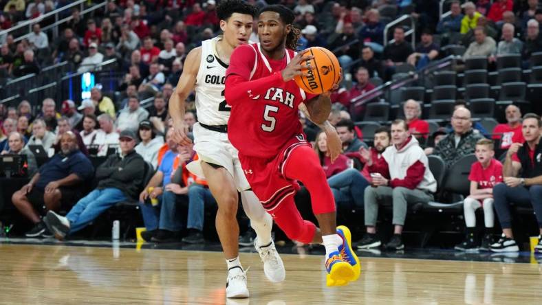 Mar 14, 2024; Las Vegas, NV, USA; Utah Utes guard Deivon Smith (5) drives to the basket against Colorado Buffaloes guard KJ Simpson (2) in the first half at T-Mobile Arena. Mandatory Credit: Kirby Lee-USA TODAY Sports