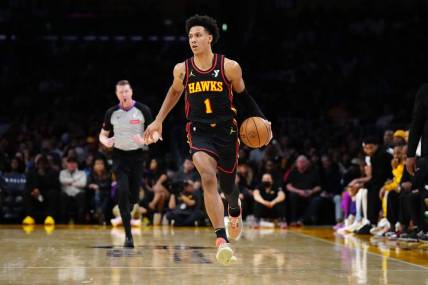 Mar 18, 2024; Los Angeles, California, USA; Atlanta Hawks forward Jalen Johnson (1) dribbles the ball against the Los Angeles Lakers in the first half at Crypto.com Arena. Mandatory Credit: Kirby Lee-USA TODAY Sports