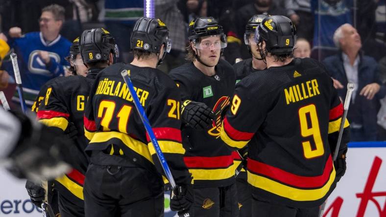 Mar 25, 2024; Vancouver, British Columbia, CAN;  Vancouver Canucks defenseman Quinn Hughes (43), forward Nils Hoglander (21), forward Brock Boeser (6), forward J.T. Miller (9) and forward Elias Pettersson (40) celebrate Boeser’s goal against the Los Angeles Kings in the third period at Rogers Arena. Kings won 3 -2. Mandatory Credit: Bob Frid-USA TODAY Sports