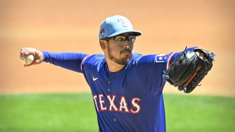 Mar 26, 2024; Arlington, Texas, USA; Texas Rangers starting pitcher Dane Dunning (33) pitches against the Boston Red Sox during the first inning at Globe Life Field. Mandatory Credit: Jerome Miron-USA TODAY Sports