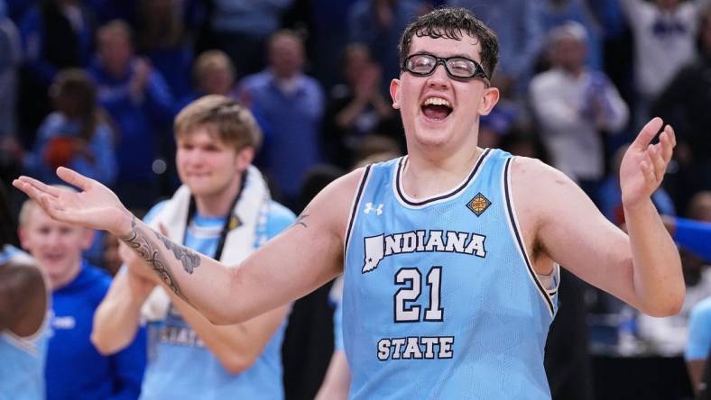 Indiana State Sycamores center Robbie Avila (21) yells in excitement Tuesday, March 26, 2024, after defeated the Cincinnati Bearcats in the quarterfinals of the NIT at the Hulman Center in Terre Haute. The Indiana State Sycamores defeated the Cincinnati Bearcats, 85-81.