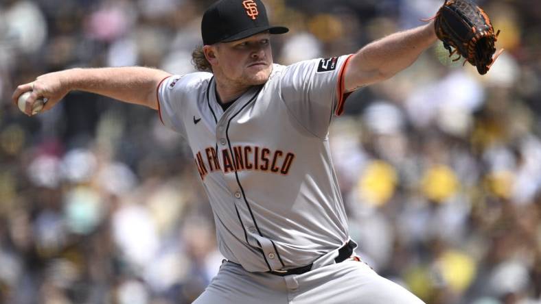 Mar 28, 2024; San Diego, California, USA; San Francisco Giants starting pitcher Logan Webb (62) throws a pitch against the San Diego Padres during the first inning at Petco Park. Mandatory Credit: Orlando Ramirez-USA TODAY Sports