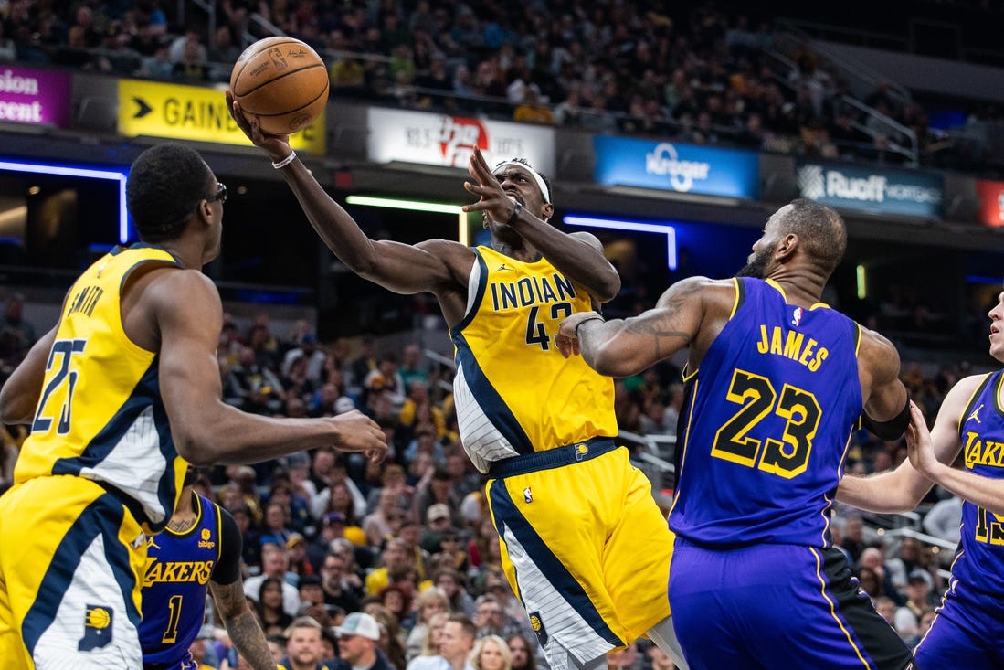 Mar 29, 2024; Indianapolis, Indiana, USA; Indiana Pacers forward Pascal Siakam (43) shoots the ball while Los Angeles Lakers forward LeBron James (23) defends in the first half at Gainbridge Fieldhouse. Mandatory Credit: Trevor Ruszkowski-USA TODAY Sports