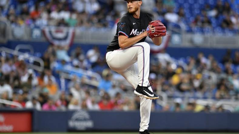 Mar 29, 2024; Miami, Florida, USA;  Miami Marlins starting pitcher A.J. Puk (35) winds up to throw a pitch during the first inning against the Pittsburgh Pirates at loanDepot Park. Mandatory Credit: Michael Laughlin-USA TODAY Sports