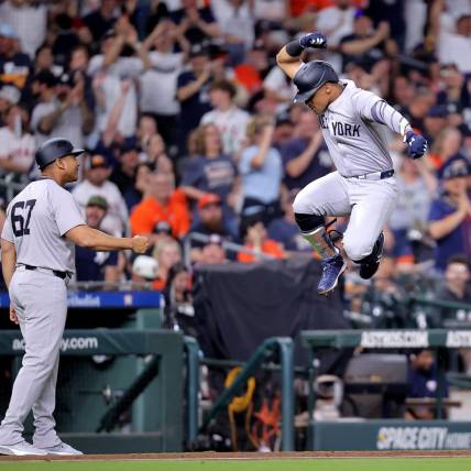 Mar 30, 2024; Houston, Texas, USA; New York Yankees right fielder Juan Soto (22, right) reacts after hitting a home run to left field against the Houston Astros during the seventh inning at Minute Maid Park. Mandatory Credit: Erik Williams-USA TODAY Sports
