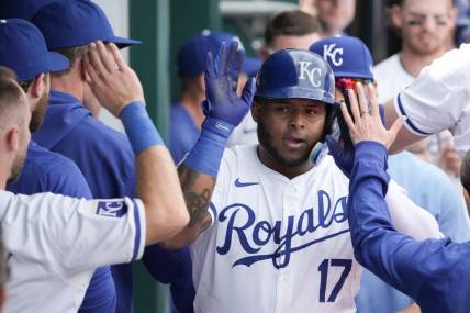 Mar 31, 2024; Kansas City, Missouri, USA; Kansas City Royals right fielder Nelson Velazquez (17) is congratulated in the dugout against the Minnesota Twins after hitting a solo home run in the sixth inning at Kauffman Stadium. Mandatory Credit: Denny Medley-USA TODAY Sports