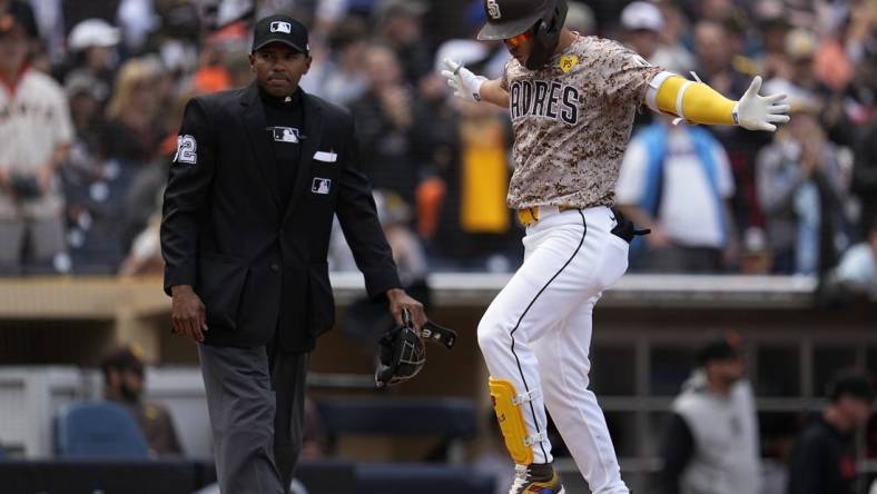 Mar 31, 2024; San Diego, California, USA; San Diego Padres shortstop Ha-Seong Kim (7) reacts after hitting a home run against the San Francisco Giants during the second inning at Petco Park. Mandatory Credit: Ray Acevedo-USA TODAY Sports