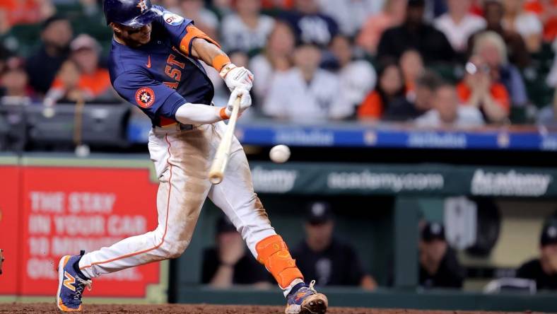 Mar 31, 2024; Houston, Texas, USA; Houston Astros shortstop Jeremy Pena (3) hits a single to right field against the New York Yankees during the ninth inning at Minute Maid Park. Mandatory Credit: Erik Williams-USA TODAY Sports