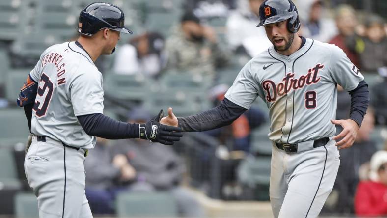 Mar 31, 2024; Chicago, Illinois, USA; Detroit Tigers right fielder Matt Vierling (8) celebrates with first baseman Spencer Torkelson (20) after scoring against the Chicago White Sox during the ninth inning at Guaranteed Rate Field. Mandatory Credit: Kamil Krzaczynski-USA TODAY Sports