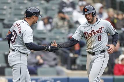 Mar 31, 2024; Chicago, Illinois, USA; Detroit Tigers right fielder Matt Vierling (8) celebrates with first baseman Spencer Torkelson (20) after scoring against the Chicago White Sox during the ninth inning at Guaranteed Rate Field. Mandatory Credit: Kamil Krzaczynski-USA TODAY Sports