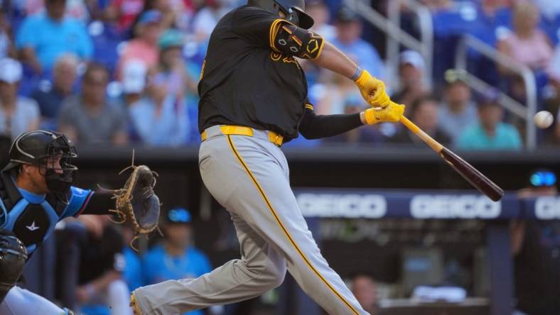 Mar 31, 2024; Miami, Florida, USA;  Pittsburgh Pirates first baseman Rowdy Tellez (44) hits a two-run home run in the seventh inning to give the Pirates the lead over the Miami Marlins at loanDepot Park. Mandatory Credit: Jim Rassol-USA TODAY Sports