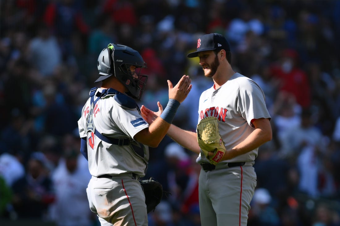 Mar 31, 2024; Seattle, Washington, USA; Boston Red Sox catcher Reese McGuire (3) and relief pitcher Justin Slaten (63) celebrate defeating the Seattle Mariners at T-Mobile Park. Mandatory Credit: Steven Bisig-USA TODAY Sports