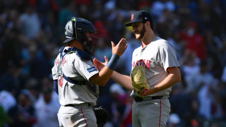 Mar 31, 2024; Seattle, Washington, USA; Boston Red Sox catcher Reese McGuire (3) and relief pitcher Justin Slaten (63) celebrate defeating the Seattle Mariners at T-Mobile Park. Mandatory Credit: Steven Bisig-USA TODAY Sports