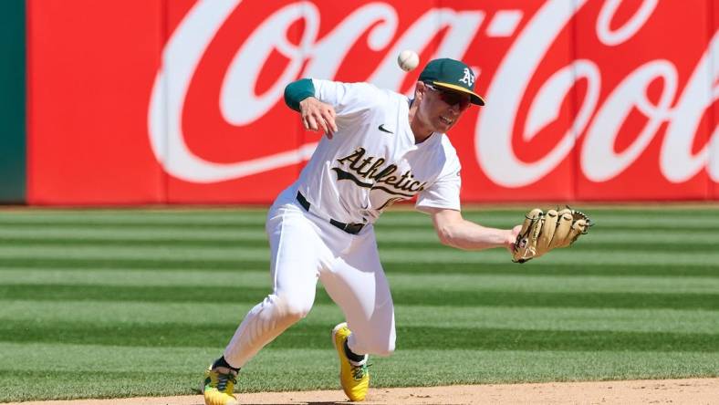 Mar 31, 2024; Oakland, California, USA; Oakland Athletics infielder Nick Allen (10) makes an error against the Cleveland Guardians during the eighth inning at Oakland-Alameda County Coliseum. Mandatory Credit: Robert Edwards-USA TODAY Sports