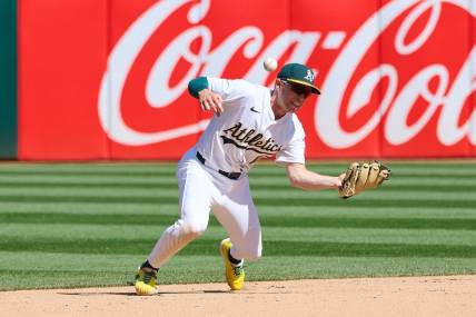 Mar 31, 2024; Oakland, California, USA; Oakland Athletics infielder Nick Allen (10) makes an error against the Cleveland Guardians during the eighth inning at Oakland-Alameda County Coliseum. Mandatory Credit: Robert Edwards-USA TODAY Sports