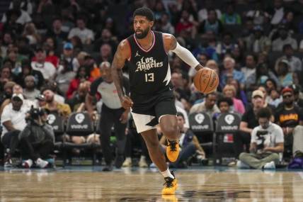 Mar 31, 2024; Charlotte, North Carolina, USA; LA Clippers forward Paul George (13) brings the ball up court against the Charlotte Hornets during the second half at Spectrum Center. Mandatory Credit: Jim Dedmon-USA TODAY Sports