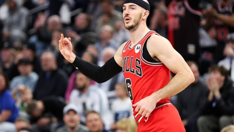 Mar 31, 2024; Minneapolis, Minnesota, USA; Chicago Bulls guard Alex Caruso (6) celebrates his three-point basket against the Minnesota Timberwolves during the second half at Target Center. Mandatory Credit: Matt Krohn-USA TODAY Sports