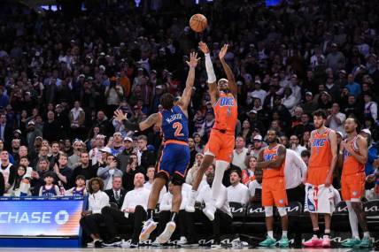 Mar 31, 2024; New York, New York, USA; Oklahoma City Thunder guard Shai Gilgeous-Alexander (2) hits the game winning basket with 1.8 seconds remaining in the fourth quarter while being defended by New York Knicks guard Miles McBride (2) at Madison Square Garden. Mandatory Credit: John Jones-USA TODAY Sports